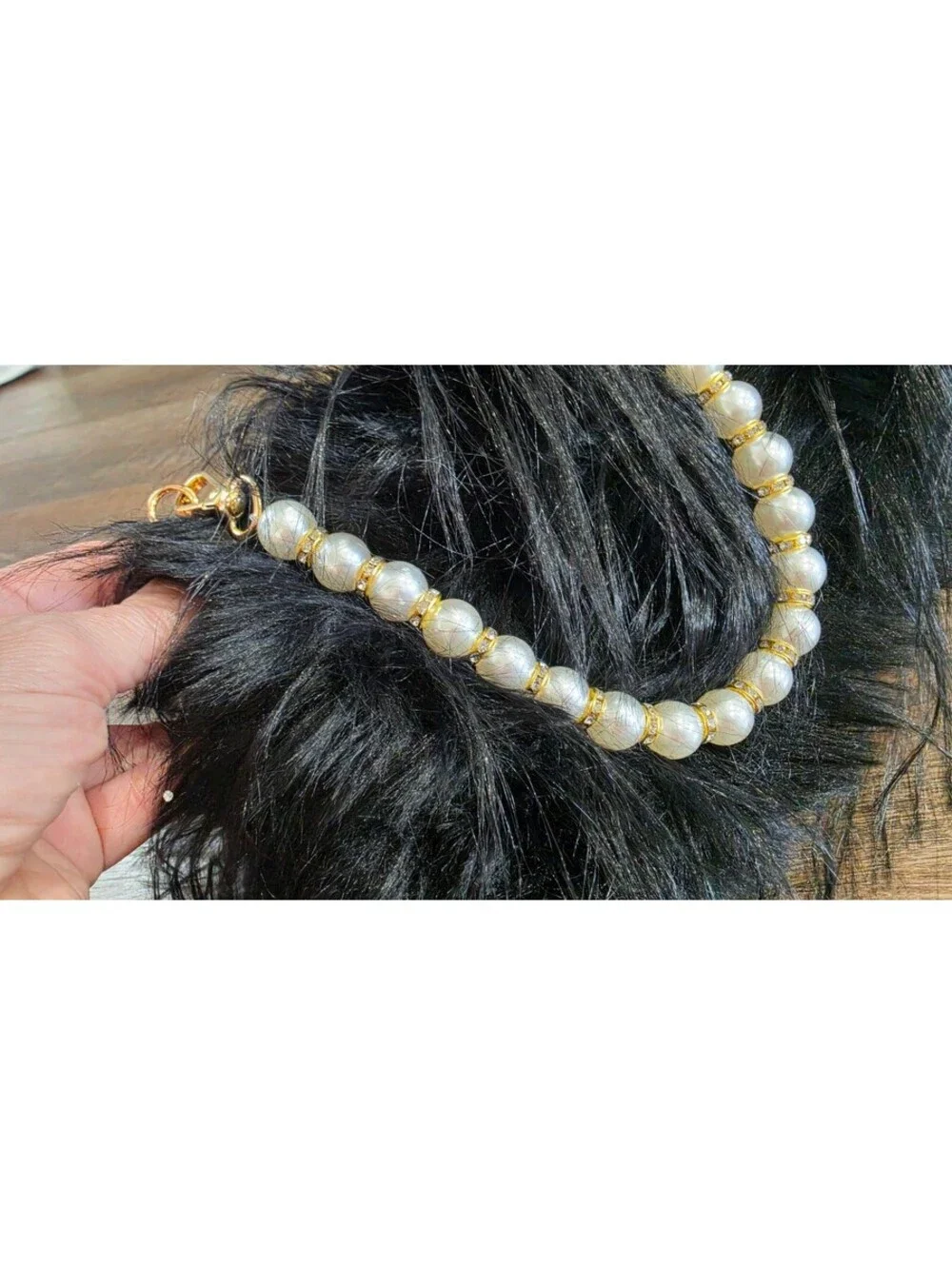 Elegant Black Faux Fur Clutch Bag with Pearl Handle and Gold Frame